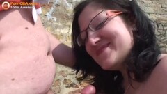 Amateur milf sucking cock on her knees in outdoor Thumb