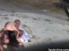 Voyeur's camera catches a couple having sex on the beach Thumb